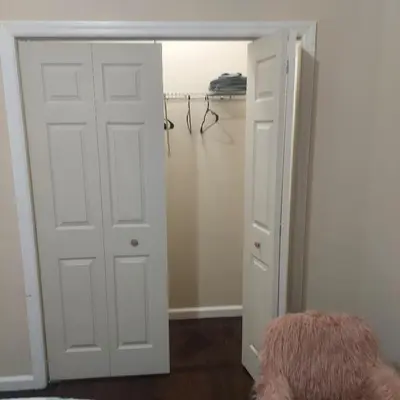 a closet with a white door and a closet at Double queen room 6 minutes walk to Penn station NYC EWR in Jersey City