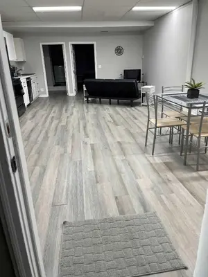 a living room with a table and a couch at Private Apartment in Southbury 102 in Southbury