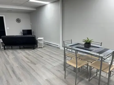 a conference room with a table and chairs in it at Private Apartment in Southbury 102 in Southbury