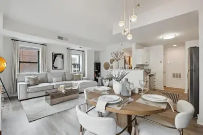 a living room with a couch and a table at Luxurious 1BR Downtown Stamford in Stamford