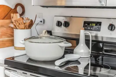 a pot sitting on top of a stove at Luxurious 1BR Downtown Stamford in Stamford