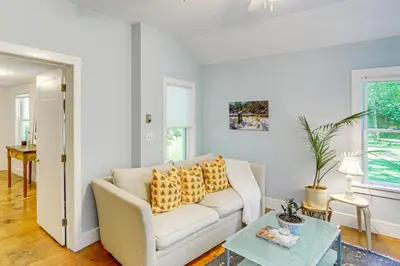 a living room with a couch and a table at Historic Catskills Farmhouse Ski, Hike and Relax! in Catskill