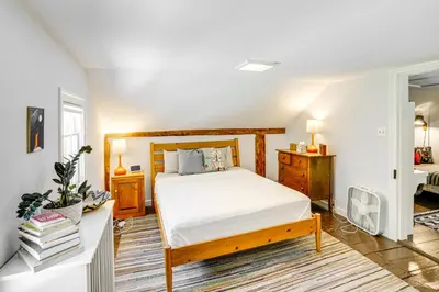 a bedroom with a bed and a desk at Historic Catskills Farmhouse Ski, Hike and Relax! in Catskill