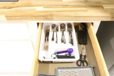 a tool cabinet with scissors and other tools in it at Luxury king bed parking & washer in Schenectady