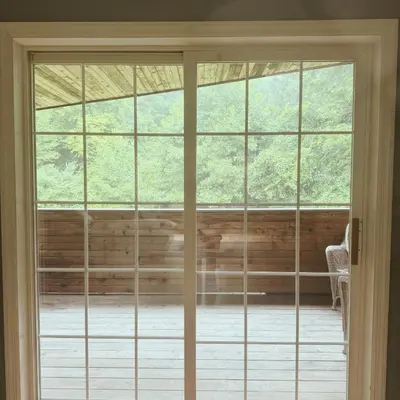 an open door to a room with windows at Quiet Cozy Stay Spacious Home Near Beach & Shops in Hamden