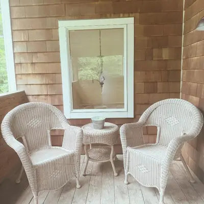 a porch with two chairs and a table and a mirror at Quiet Cozy Stay Spacious Home Near Beach & Shops in Hamden