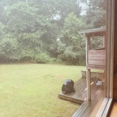 a backpack sitting on the porch of a house at Quiet Cozy Stay Spacious Home Near Beach & Shops in Hamden