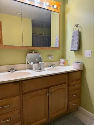 a bathroom with a sink and a mirror at Quiet Cozy Stay Spacious Home Near Beach & Shops in Hamden