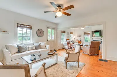 a living room with a couch and a ceiling fan at Historic Farmhouse Near Mountains and Colleges! in Westfield