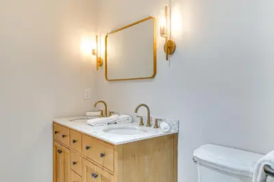 a bathroom with a sink and a mirror at Saratoga Springs Home with Hot Tub Walk to Downtown in Saratoga Springs