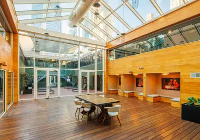 a dining room with a table and chairs in a building at Hudson Yards Hotel in New York