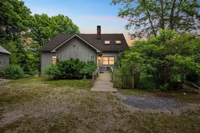 a house with a staircase leading up to it at Bear Pass - Mountain View home in Sunderland