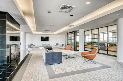 an office with a lobby with chairs and a table at Blueground UES pool gym nr central park NYC-1293 in New York