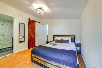 a bedroom with a large bed in a room at Nature Escape in Unadilla Modern Home with 2 Decks in Unadilla