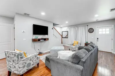 a living room with a couch and two chairs at 2 Mi to Dtwn Well-Appointed Bridgeport Duplex! in Bridgeport