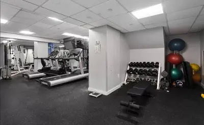 a gym with lots of exercise equipment and balloons at 73-304 Newly Reno Studio UWS Doorman Gym Laundry in New York
