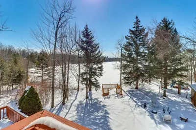 an aerial view of a snow covered yard with trees at Private Hot Tub Lakefront Poconos Home! in Pocono Summit