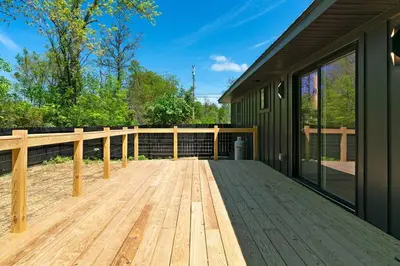 a wooden deck in front of a house at New Paltz Modern Zen Cabin in New Paltz