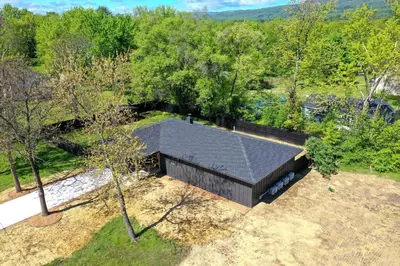 an overhead view of a house with a black roof at New Paltz Modern Zen Cabin in New Paltz