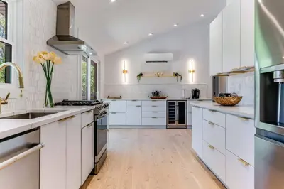 a kitchen with white counters and white cabinets at New Paltz Modern Zen Cabin in New Paltz