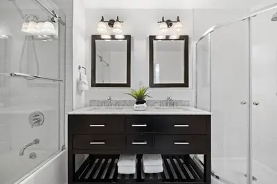 a bathroom with a sink and a shower at The Lenox in New York