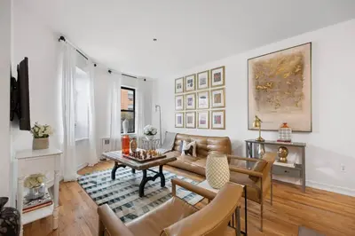 a living room with a couch and a table at Harlem Renaissance in New York