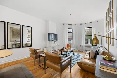 a living room with a couch and a table at Harlem Renaissance in New York