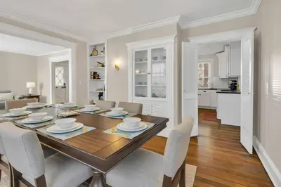 a dining room with a wooden table and chairs at Prime West Hartford Center- Timeless Charm in West Hartford