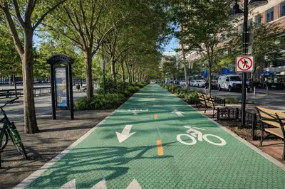 a bike path in a city with trees and a street at Hoboken 15 Min Train to Manhattan Full Kitchen in Hoboken
