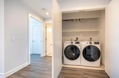 a laundry room with a washer and dryer at Private Apt with Gym & Pool in Stamford