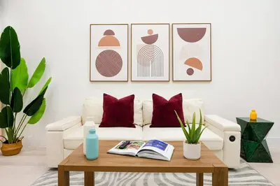 a living room with a white couch and a coffee table at 317-1D New 2BR Duplex WD Private Backyard in New York