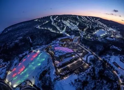 an aerial view of a city at night at The Beautiful & Cozy Malvec Chalet in Tobyhanna