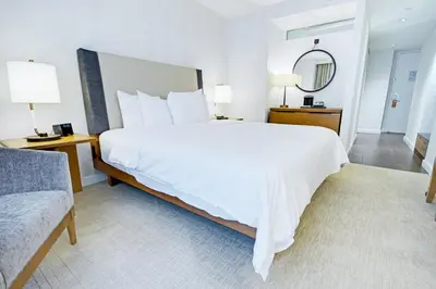 a large white bed in a hotel room at Beautiful Resort in Midtown 45 - Deluxe 1BD in New York