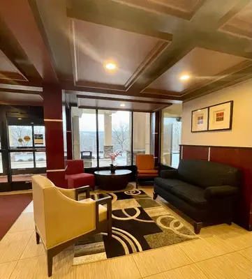 a living room with a couch and chairs at BEST WESTERN PLUS Poconos in Tannersville