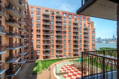 a balcony view of a large apartment building at Global Luxury Suites at Hoboken Waterfront in Hoboken