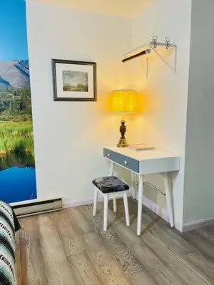 a desk with a lamp and a chair in a room at Catskill Cabin, Chill Apartment, 1st Fl in Shandaken