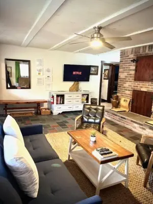 a living room with a couch and a table at Catskill Cabin, Chill Apartment, 1st Fl in Shandaken