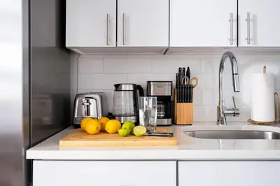 a kitchen counter with a cutting board with fruit on it at 444-3A Newly renovated 1BR - Elevator Building in New York