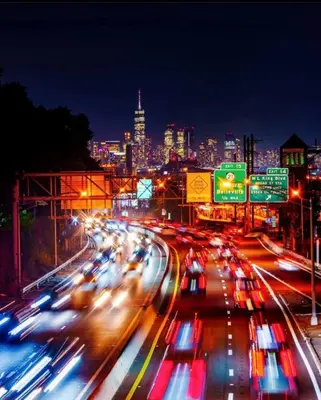 a busy city street at night with cars at Belmont Suites - BR 2 (Private Room) - 30 mins to NYC in Newark
