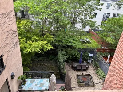 an overhead view of a garden with a table and chairs at 2 bedrooms with one private bathroom in lovely home in New York