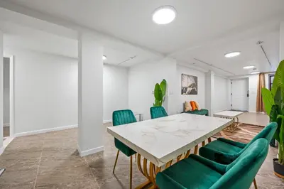 a meeting room with a table and green chairs at Active Central Park East 3bedrooms 2 bathrooms 1700 SF in New York