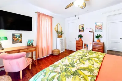 a bedroom with a desk and a bed and a desk at The Jewel of The Cove - Historic Coastal Retreat in New Haven