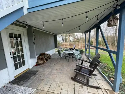 a patio with a table and chairs on a house at Welcome to our Retreat Haven in Warwick, NY in Warwick