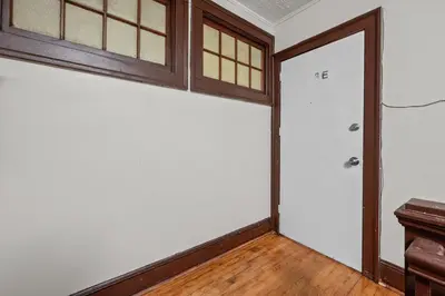 an empty room with a door and wooden floors at Downtown Hartford 2BR Family Pet Friendly in Hartford