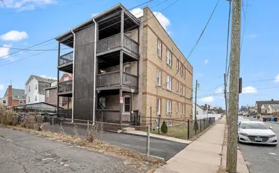 an apartment building on the corner of a street at Downtown Hartford 2BR Family Pet Friendly in Hartford