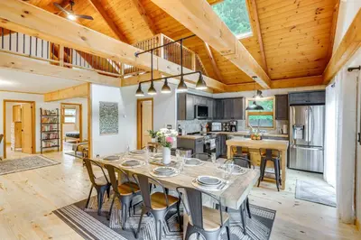 a dining room and kitchen with a table and chairs at Stylish Catskills Retreat Year-Round Adventure! in Round Top