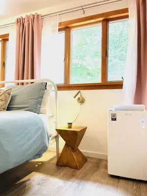 a bedroom with a bed and a window at Catskills, The Bohemian Dream in Shandaken