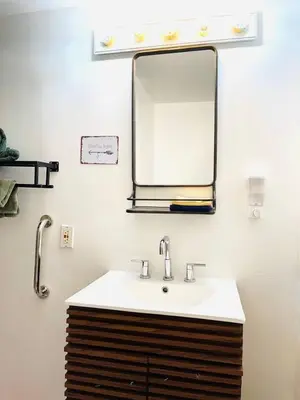 a bathroom with a sink and a mirror at Catskills, The Bohemian Dream in Shandaken