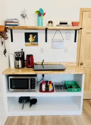 a kitchen counter with a microwave on a shelf at Catskill Cabin Bird of Paradise 7 in Shandaken