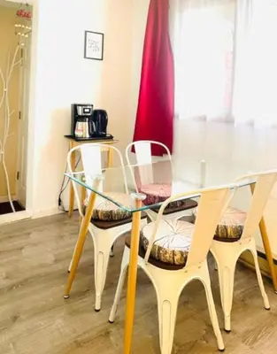 a dining room table with two chairs and a glass table at Lotus Family Suite w 2 Beds Kitchenette 4 in Shandaken